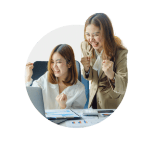 Two female business owners discussing and researching customer retention strategies