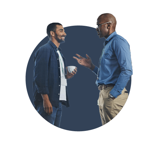 Two male business owners discussing the sales realities that successful business owners know